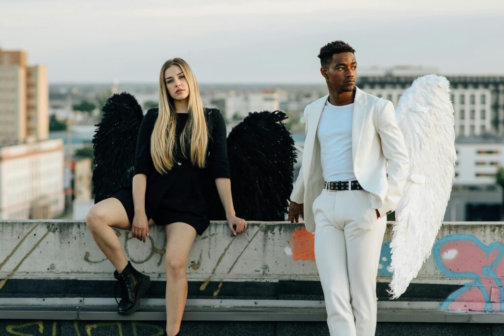 A Man and Woman Wearing Angel Costumes